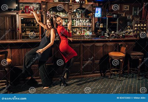 two beautiful women having fun at the bar stock image image of cocoa glass 83473303