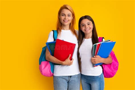 School Learning And Education Concept Mother And Daughter Schoolgirls With School Backpack And