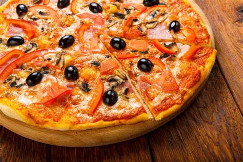 Delicious Pizza With Salami Mushrooms And Olives Stock Image Image
