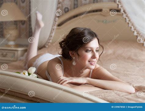 Woman In Lingerie Lying On Bed Stock Photo Image 23987858
