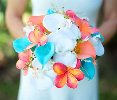 We hope you liked this blog post on ways to use and style coral wedding decoration pieces for your wedding. Wedding Coral Orange and Turquoise Teal Natural Touch Orchids
