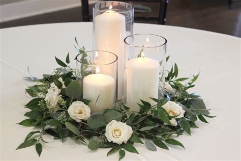 Greenery And Spray Rose Centerpiece With Pillar Candles Celebration Flair Candle Wedding