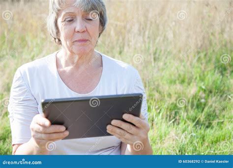 Senior Woman Using Tablet Device Stock Photo Image Of Device