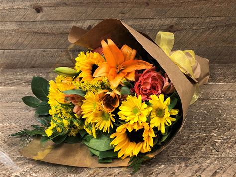 Arm Bouquet Wrapped In Sunshine Blossom And Basket Boutique