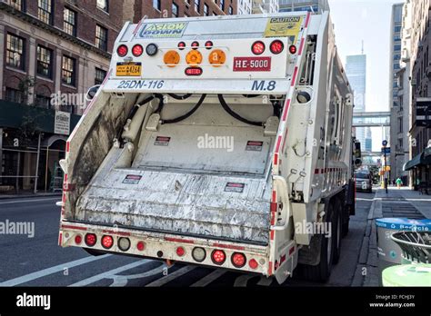 New York City Garbage Collection Truck Making It´s Pick Up Rounds On