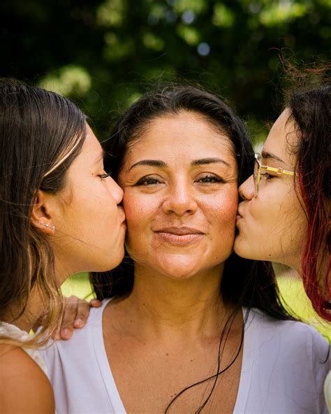 Three Women Kissing Each Other With Their Noses Close Together Photo Free Kissing Image On