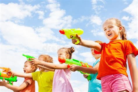 Five Kids Play With Water Guns Stock Photo Image 42628566