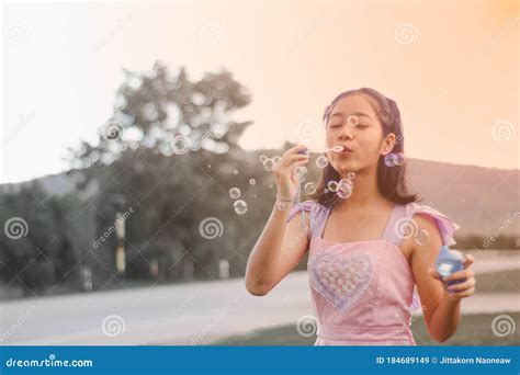 The Girl Is Blowing Bubbles Happily Stock Image Image Of Colorful