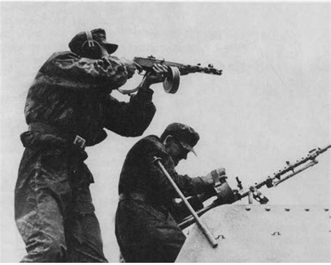 German Sp Gun Crewman Laying Covering Fire With Soviet Ppsh 41 Smg