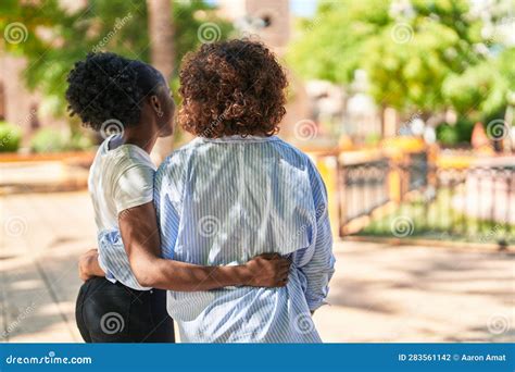 African American Women Mother And Daughter Hugging Each Other At Park Stock Photo Image Of