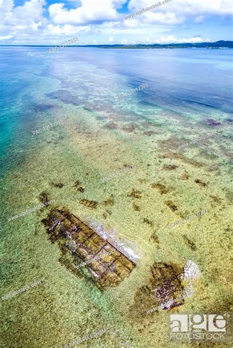 An Aerial View Of The Remains Of A Shipwreck On The Outer Reef Off The