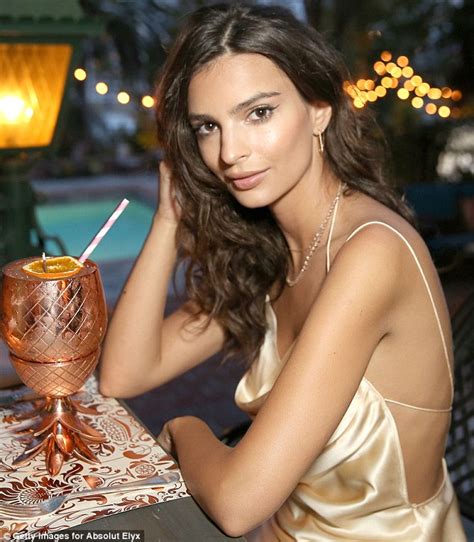 Braless Emily Ratajkowski Flashes Considerable Cleavage In Tight Gold