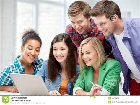 Group Of Happy High School Students With Laptop Stock