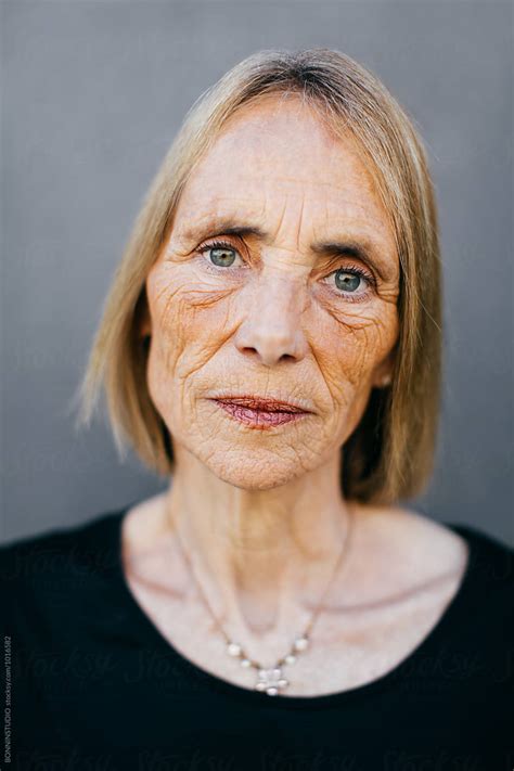 Closeup Portrait Of A Wrinkled Senior Woman. by BONNINSTUDIO - Boomer