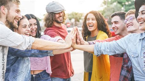 Group Of Diverse Friends Stacking Hands Outdoor Happy Young People