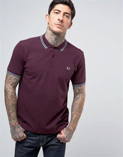 From fred perry polo shirts that show the brands affinity with it's founder's athletic background, to fred perry shirts that embody its movement from sportswear to some of british history's most influential fashion movements, the fred perry label is testament to individual, faithful design. Fred Perry | Fred Perry Slim Pique Polo Shirt Twin Tipped ...