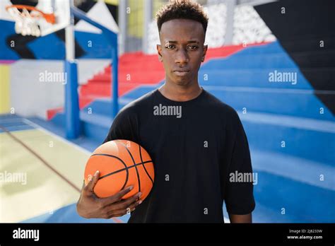 Young African Man Playing Basketball Outdoor Focus On Face Stock