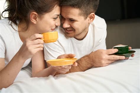 Guy And His Girlfriend Drink Morning Coffee On The Bed Stock Image Image Of Romantic Leisure
