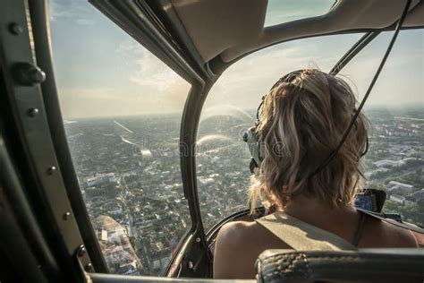 Portrait Of Beautiful Blonde Women Enjoying Helicopter Flight She Is