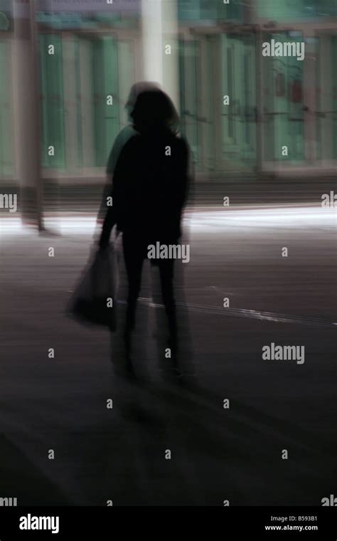 One Woman Walking In Street At Night Stock Photo Alamy