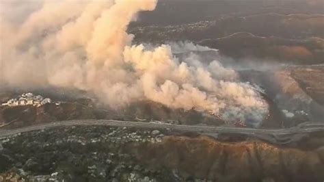 Wind Driven Wildfire Near Getty Center Threatens Homes Forces