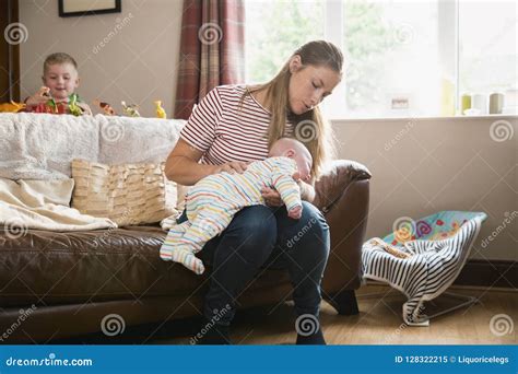Mother Burping Baby After Bottle Feeding Stock Photo Cartoondealer