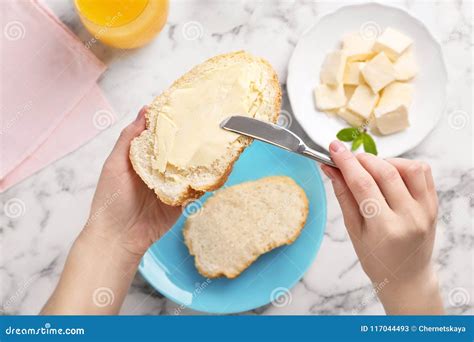 Woman Spreading Butter On Slice Of Bread Over Table Stock Image Image Of Delicious Butter