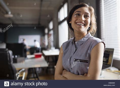 Smiling Businesswoman In Office Stock Photo Alamy