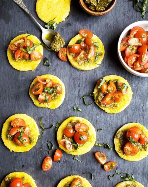 A nice alternative to toasted bread, this polenta bruschetta can be accompanied with any type of topping imaginable, is quick to make, easy to keep, and a great way to start a meal. Pesto Polenta Bites with Tomato Bruschetta | Recipe ...