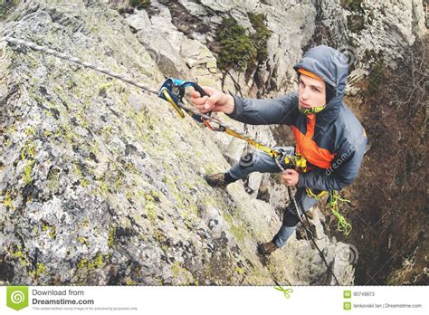 Young White Man Climbing A Steep Wall In The Mountains Climbing Extreme Sports Wide Angle