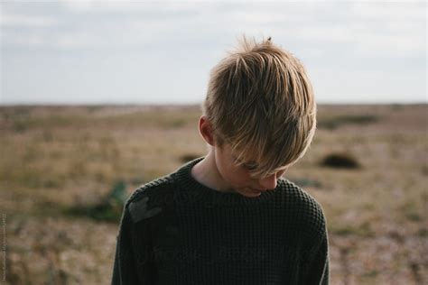 Portrait Of A Teenage Boy Looking Down By Stocksy Contributor Helen