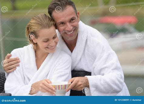 Couple In Bathrobes Sharing Drink Outdoors Stock Image Image Of Male Bathrobes 121238091
