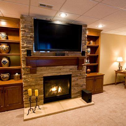 10 ingenious ways to style your fireplace mantel. hgtv indoor stone veneer | Basement tv above fireplace ...