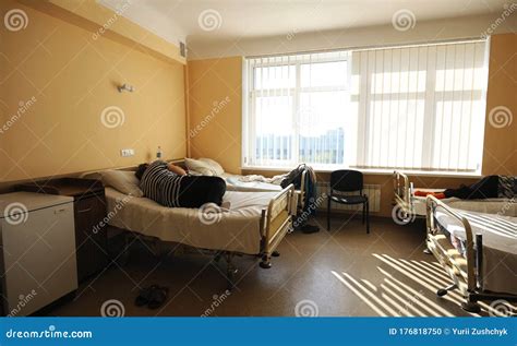 At A Hospital Room Women Patients Lying On Hospital Beds Stock Photo