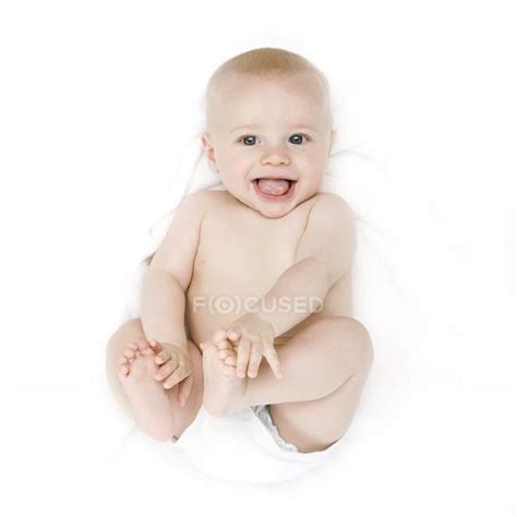 Baby Babe Lying Down And Smiling Babe Happiness Stock Photo