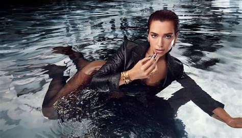 Sultry Dua Lipa Poses Seductively In A Pool As She Models Lipstick