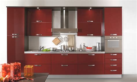 The flat canopy and straight chimney are there to do the job. Luxury Home Interior Design: Red Color Kitchen Design