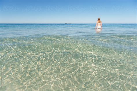 A Girl Walking In Clear Water At The Beach In Summer By Angela Lumsden