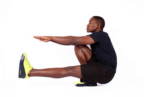 Muscular Man Demonstrates How To Do Pistol Squat One Legged Squat Exercise
