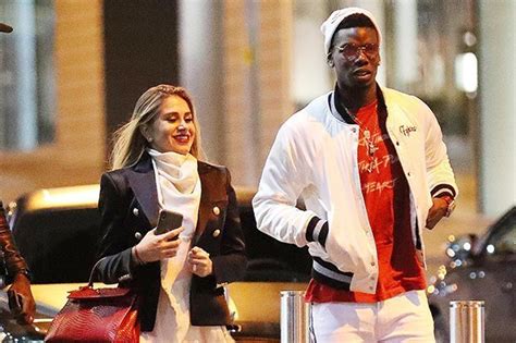The couple have been dating for at least a year (image: Manchester United star Paul Pogba dines out with ...