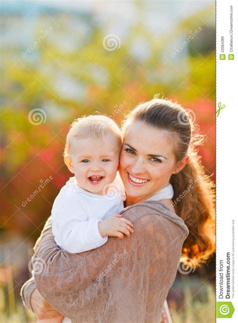 Happy Mother With Smiling Baby On Street Stock Photo Image Of Child