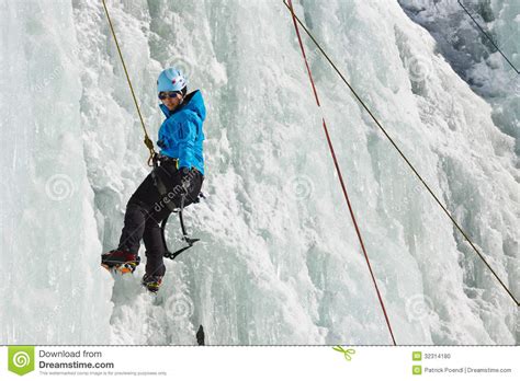 Female Ice Climber In South Tyrol Italy Stock Photo