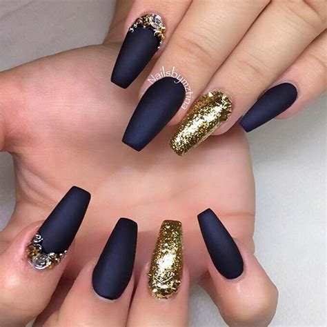 Lacy nail designs are also sweet and feminine, and this baby blue and black design looks gorgeous! Luxurious Black and Gold Nails | NailDesignsJournal.com