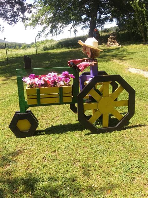 Pin By Jon Tay On Tractor Planters Wood Yard Art Garden Crafts Diy