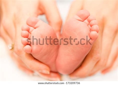 Newborn Baby Feet On Female Hands Stock Photo 173209736 Shutterstock
