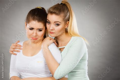 Woman Hugging Her Sad Female Friend Stock Photo And Royalty Free