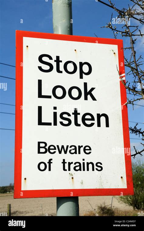 Stop Look Listen Beware Of Trains Warning Sign At A Level Crossing