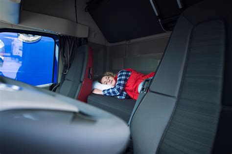 Truck Driver Sleeping On Bed Inside Truck Cabin Interior Trucker