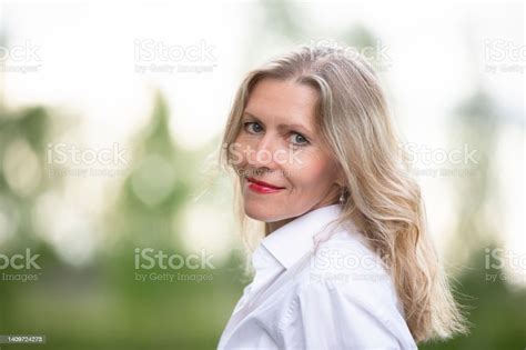 Portrait Of A Beautiful European Middleaged Woman Fiftyyearold Blonde