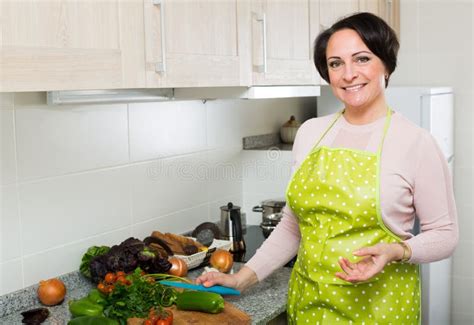 Portrait Of Cooking Brunette Housewife In Apron Stock Photo Image Of